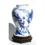 A Chinese Kangxi period blue & white vase decorated with a warrior on horseback with attendants