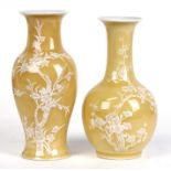 Two Chinese yellow ground vases decorated with prunus, the largest 20cms (8ins) high.