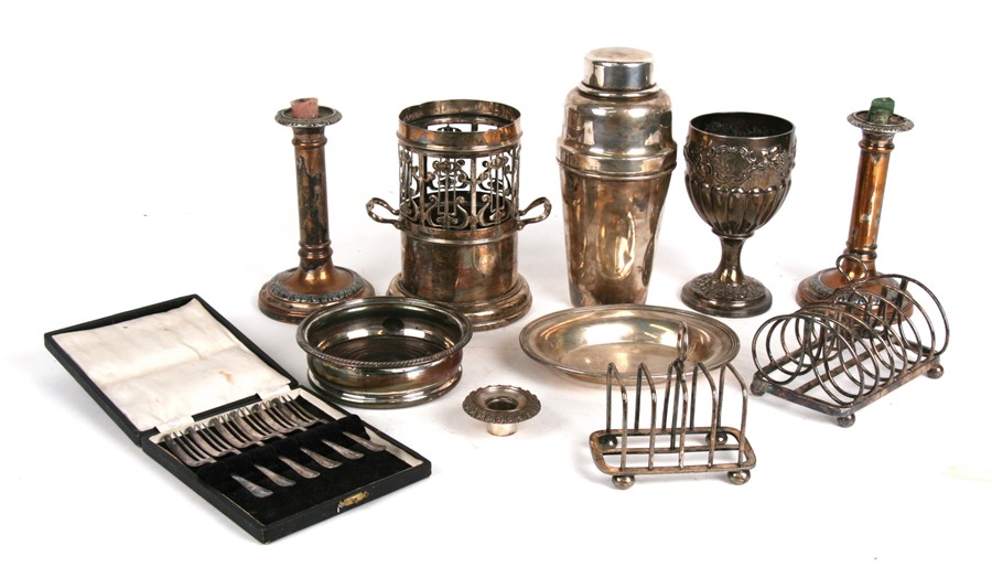 A quantity of silver plated items to include toast racks, goblet, cocktail shaker, wine coaster