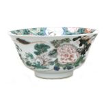 A Chinese famille verte bowl decorated with flowers and calligraphy, 21cms (8.25ins) diameter.