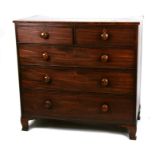 A 19th century mahogany chest with two short and three graduated long drawers, 109cms (43ins) wide.