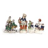 Three 19th century Staffordshire pottery groups; together with a continental porcelain group, the