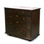 An early 19th century mahogany chest with two short and three long graduated drawers, 96cms, (38ins)