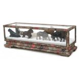 A group of Chinese hardstone Horses of Mu Wang in a textile and glazed display box, 32cms (12.