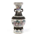 A Chinese famille rose crackle glaze vase decorated with figures on horseback, with incised four
