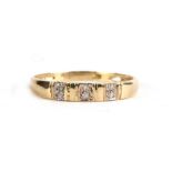 A 9ct gold three-stone diamond ring, approx UK size 'P'.