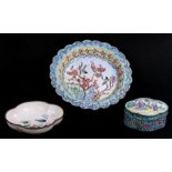A Chinese enamel box decorated with figures, flowers and foliate scrolls on a turquoise ground,