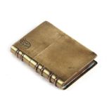 A trench art brass and copper book form lighter, 5.5cms (2.2ins) high.