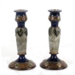 A pair of Royal Doulton Stoneware candlesticks, 19cms (7.5ins) high.Condition Report Good