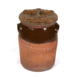 A two-handled stoneware bread crock with pine lid, 42cms (16.5ins) high.