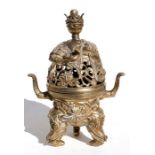 An 18th century Chinese bronze two-handled censer, the pierced top being a recumbent elephant, on