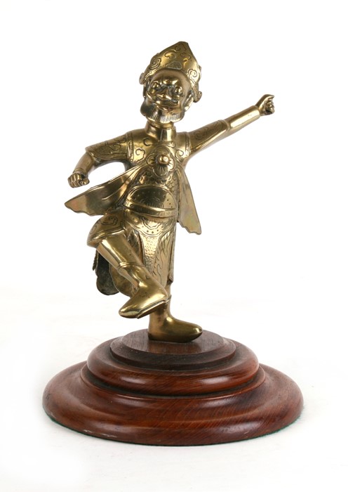 A Chinese polished bronze / brass figure in the form of a bearded man, mounted on a later hardwood