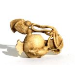 A 19th century Japanese ivory okimono depicting a rat crawling on a rope, 4cms 1.5ins) long.