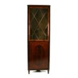 A mahogany corner display cabinet, the astragal glazed door with cupboards beneath, 61cms (24ins)