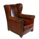 An early 20th century leather club armchair.