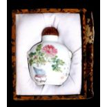 A Chinese Republic porcelain snuff bottle decorated with flowers in a vase and calligraphy, with