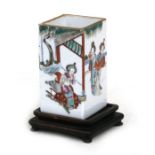 A Chinese square form brush pot on stand, decorated with figures with red seal mark to underside,