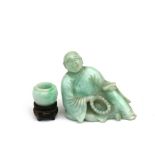 A Chinese jadeite figure in the form of a seated robed man holding a scroll and beads, 10cms (