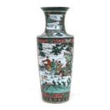 A Chinese famille rose vase decorated with a hunting scene to one side and a court procession on the