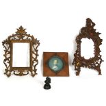 A Chinese bronze bird form opium weight; together with a gilt metal mirror and two photograph frames