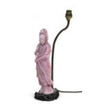 A Chinese pink Peking glass figural table lamp in the form of Guanyin, 33cms (13ins) high.