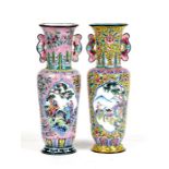 A pair of Chinese enamel vases decorated with figures within panels on a foliate pink ground, blue