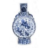 A Chinese blue & white moon flask decorated with temple lions amongst clouds with two chilong