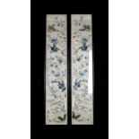 A pair of Chinese silk embroidered cuffs decorated with birds, butterflies and flowers, framed &
