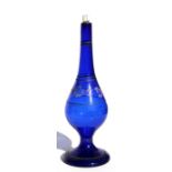 A 19th century Turkish blue glass rose water sprinkler with crescent moon and star decoration, 26cms
