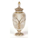 A Bohemian frosted glass vase and cover with gilt overlaid decoration, 31cms (12.25ins) high.