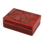 A Chinese red cinnabar lacquer box and cover decorated with figures in a landscape, 14cms (5.5ins)