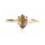A 14ct gold ring set with a single pear shaped citrine, approx UK size 'P'.