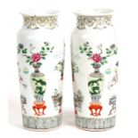 A pair of antique Chinese famille rose vases decorated with precious objects, six character blue