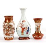 Two late 19th century Japanese Kutani miniature vases decorated with figures and flowers; together