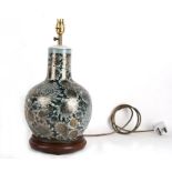 A Chinese vase decorated with gilded chrysanthemums on a green ground, converted to a table lamp,