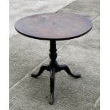 An early 19th century mahogany tilt-top table on turned column and tripod base, 73cms (28.75ins)