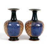 A pair of Royal Doulton Stoneware vases, 22cms (8.5ins) high.