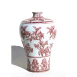 A Chinese underglazed copper red Meiping vase decorated with flowers, 26cms (10.25ins) high.