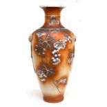 A late 19th century Japanese Satsuma vase decorated with fruit and foliage, 61cms (24ins) high.