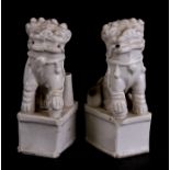 A pair of 18th / 19th century Chinese Blanc de Chine fo dog joss stick holders, 12cms (4.75ins)