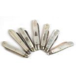 Seven silver bladed mother of pearl fruit knives.