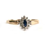 A 9ct gold diamond and sapphire cluster ring, approx UK size 'P'.