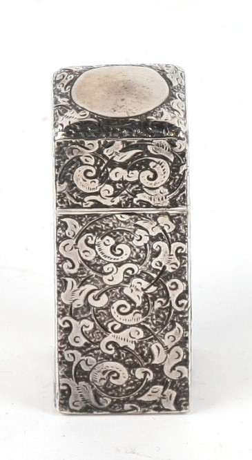 A Victorian silver scent bottle by Sampson Morden, London 1883, of square form and engraved with