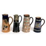 Four Royal Doulton and Doulton Lambeth stoneware water jugs, the largest 21cms (8.25ins) high (4).