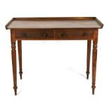 A 19th century mahogany writing table with two frieze drawers, on turned legs, 102cms (40ins) wide.