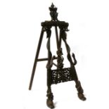 An impressive Burmese or Thai carved hardwood easel with central monkey figure flanked by