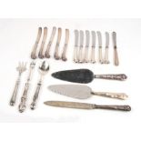 A quantity of pistol grip silver handled butter knives and other silver handled cutlery.