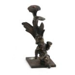 A bronze cherub mounted on a cast plinth, 14cms (5.5ins) high.