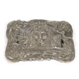 A Lillie Langtry 'The Jersey Lily' plated belt buckle, stamped 'Quezel Tiffany Studios', 8cms (3.
