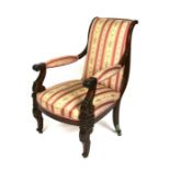 A Victorian mahogany upholstered armed chair.